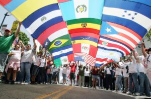 LOS ANGELES - JUNE 24: A composite of numerous flags from across the world is held by immigrant reform supporters as they march on Hollywood Boulevard in support of the legalization of millions of undocumented immigrants living in the United States June 24, 2007 in Los Angeles, California. Fire officials estimated the crowd in attendance was around three thousand people. (<a href=